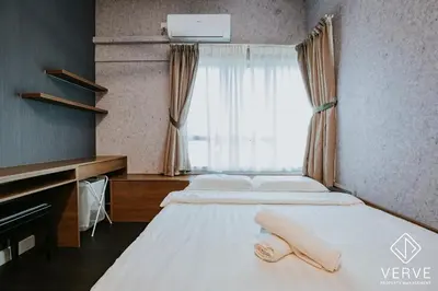 a bedroom with two beds and a window at Ipoh Residence PR1MA Kepayang 6 pax suites in Ipoh