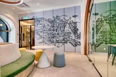 a room with a mural of a map on the wall at 22 Macalisterz Premium Suites Penang by BYON in George Town