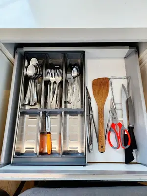 a drawer filled with lots of utensils at The Tiny Treasure Stay #1BR in George Town