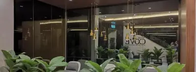 a conference room with plants and chandeliers at The Cove 4-7 pax in Ipoh