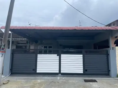 a garage with a black and white garage door at Homestay Bonda F in TanjongMalim