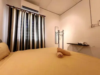 a bedroom with a bed with a towel on it at Vintage Comfort 3Bedroom Haus in Lunas