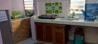 a kitchen with a sink and a counter top at Homestay Bajet IPOH in Ipoh