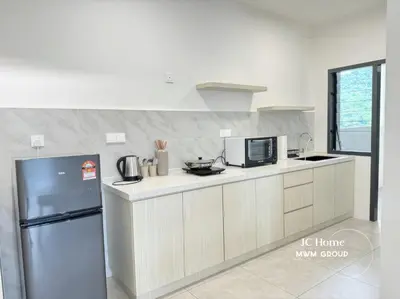 a kitchen with a refrigerator and a microwave at Family Suites Netflix House Aston Acacia Bukit Mertajam in Bukit Mertajam