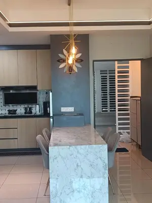 a kitchen with a marble counter top and a chandelier at Airra Minimalist Suite-Ipoh Town in Ipoh