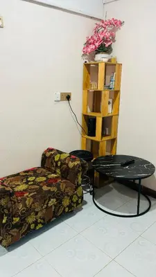 a living room with a couch and a table at Capital O 91187 D'dusun Raudhah Chalet in Baling