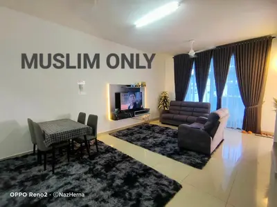a living room with a couch and a tv at NH Stay, Parit Buntar Perak in Parit Buntar