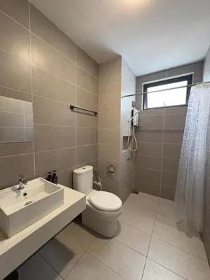 a bathroom with a toilet and a sink at Aston Acacia Homestay in Bukit Mertajam