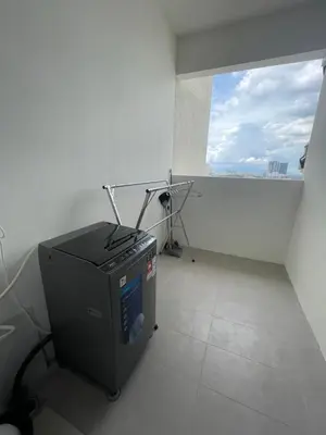 an office with a computer in a room with a window at Aston Acacia Homestay in Bukit Mertajam