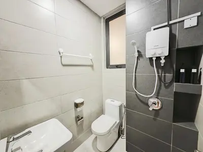 a bathroom with a white toilet and a sink at Georgetown 2BR Luxury Condo Unbeatable Night View Infinity Pool Attractions Food Fully Equipped#148B in Bayan Lepas