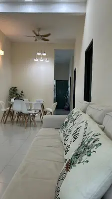 a living room with a couch and a dining room at Mimi's Nest - Fully furnished, wifi at Tronoh in Teronoh
