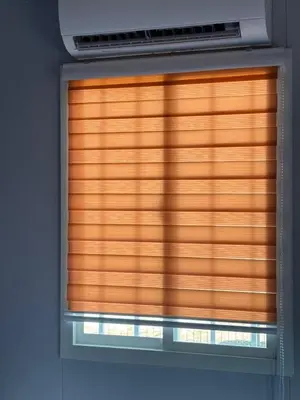 a window with wooden blinds in a room at Roomstay Kontena Sungai Bioh in Gua Sai