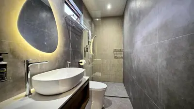 a bathroom with a sink and a toilet at Room 11 by 10 Mentigi in Tanah Rata