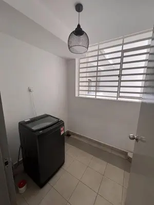 a room with a trash can and a window at Palette & Pool Haven in Ipoh