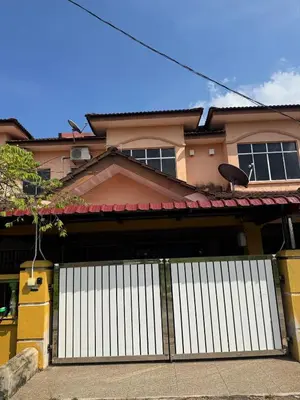 a house with a white gate in front of it at Homestay NIA Chukai in Gua Sai