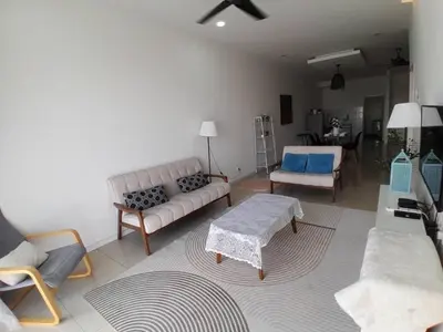 a living room with a couch and a table at Condominium Crystal Heights in Taiping
