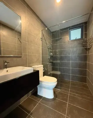 a bathroom with a toilet and a sink and a shower at Sunway Onsen Theme Park View Ipoh in Ipoh