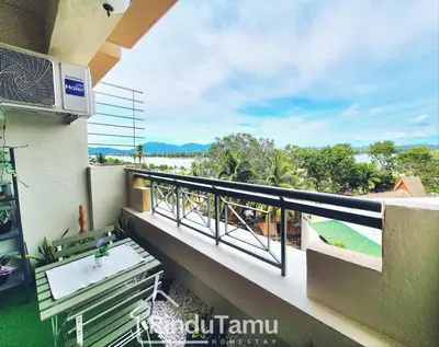 a balcony with a view of the ocean at RinduTamu Homestay in Lumut