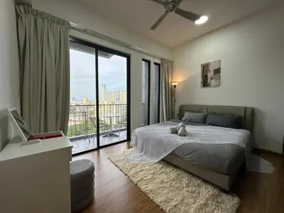 a bedroom with a bed and a large window at HOT & Modern 2BR Beacon Executive Suite, Georgetown in George Town