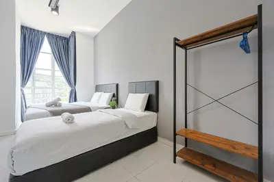 a bedroom with two beds and a sliding glass door at Chill & Bloom Brinchang Cameron Highlands Clover Home M-02 in Brinchang