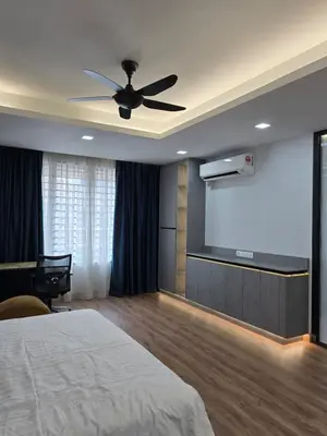 a bedroom with a bed and a projection screen at Cozy Nook Stay Bukit Tinggi 2 in Kuang