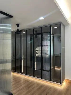 a group of glass doors in a room at Cozy Nook Stay Bukit Tinggi 2 in Kuang