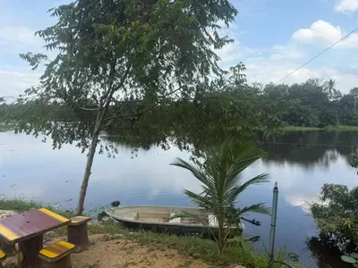 a small boat sitting on the side of a lake at TGB Buhayra CHALLET & CAMPSITE