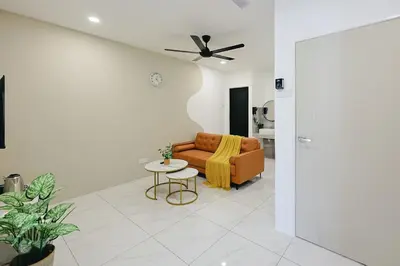a living room with a couch and a table at Cameron Centrum CozyNest with Kids Playground Brinchang Clover Home A-1-15A in Brinchang