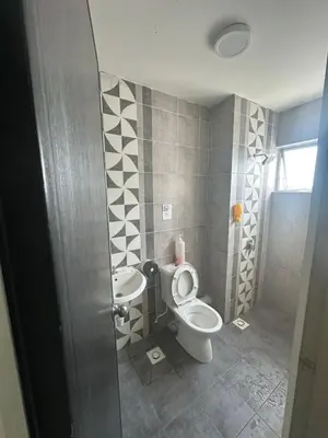 a bathroom with a toilet and a sink at Adik Aisyah homestay quintet 7-2 in Tanah Rata