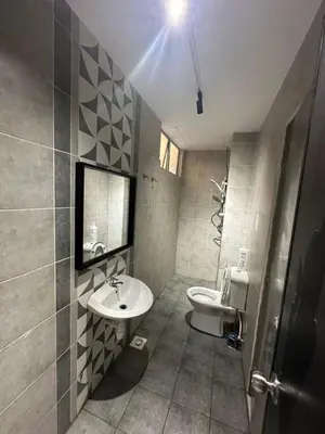a bathroom with a sink and a toilet at Adik Aisyah homestay cameron quintet A3-7-3A in Tanah Rata