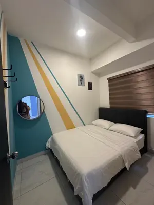 a small bedroom with a bed with a mirror at Adik Aisyah cameron homestay quintet A3-7-7 in Tanah Rata
