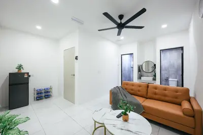 a living room with a couch and a ceiling fan at Serene Nest Cameron Centrum Brinchang Clover Home A-1-15 B in Brinchang