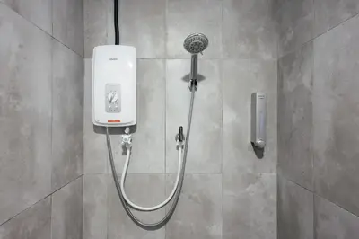 a shower in a bathroom with aitizer at Cameron Centrum Brinchang Breeze Cozy Retreat Clover Home A-2-15B in Brinchang