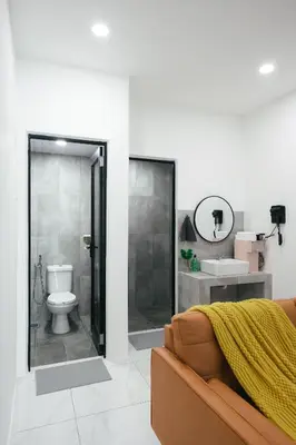 a bathroom with a shower and a toilet and a sink at Cameron Centrum Brinchang ChillSuites Peaceful Escape Clover Home A-3-15B in Brinchang