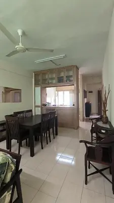 a living room with a dining room table and chairs at ANHAAZ Lakefront Retreat in Kampong Balek Bukit