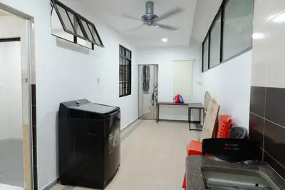 a hallway with a trash can in a room at Bm16 16pax4b3b in Bukit Mertajam