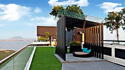 an outdoor seating area on the roof of a house at relax familystay Urban suites 3BR-10pax b30 in George Town