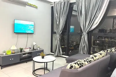 a living room with a couch and a tv at relax familystay Urban suites 3BR-10pax b30 in George Town