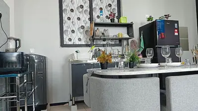 a kitchen with a counter with wine glasses on it at relax familystay Urban suites 3BR-10pax b30 in George Town