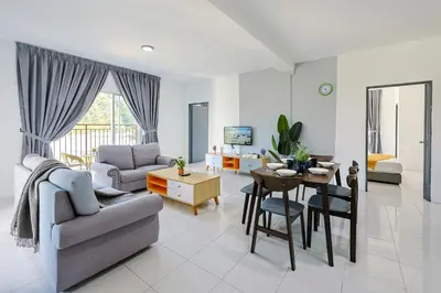 a living room with a couch and a table at Family Home In Brinchang Emerald Avenue Apartment Clover Home 3-22 in Brinchang