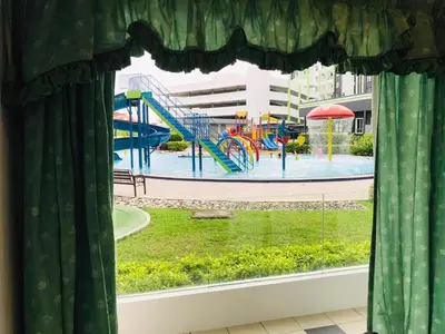 a window with a view of a playground at Bern's Homestay Manhattan Condo, Ipoh-GROUND FLOOR, POOLSIDE, FREE PARKING and WiFi in Ipoh