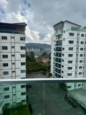 a view of two tall buildings from a balcony at AYAAN FIFA HOME at Quintet Private Parking in Tanah Rata