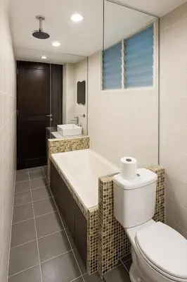 a bathroom with a tub and a toilet and a sink at Home2Stay at Marina Island in Lumut