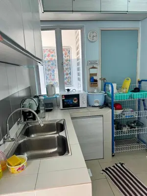 a kitchen with a sink and a dishwasher at AYAAN Fifa Game HOMESTAY At Tanah Rata with Wifi in Tanah Rata