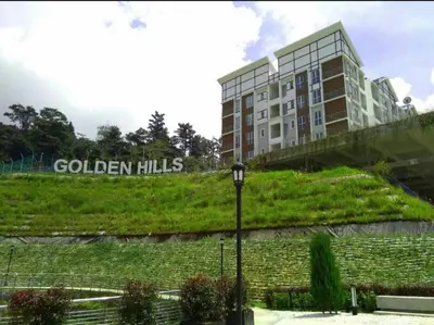 a building with the words golden hills on the side of it at Golden Hills 2 Bedroom Apartment in Brinchang