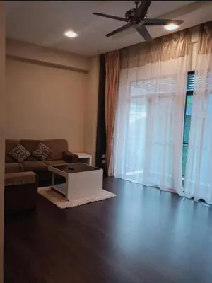 a living room with a couch and a ceiling fan at Nova Cameron Glamz in Cameron Highlands