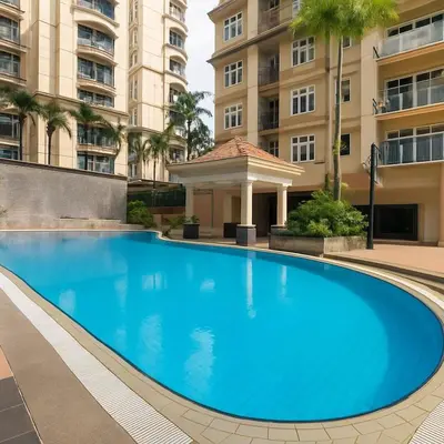 a large blue swimming pool in front of a building at Riverine Sapphire, 10-3A in Gua Sai