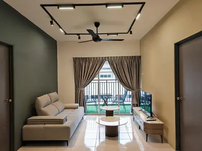 a living room with a couch and a table at W902WarmStay at EmeraldAvenueBrinchang in Brinchang