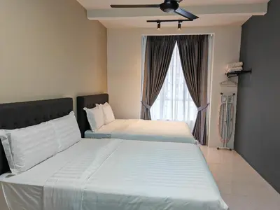 a bedroom with two beds and a window at W902WarmStay at EmeraldAvenueBrinchang in Brinchang