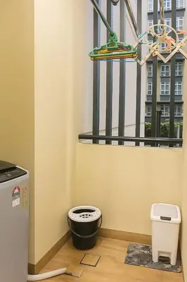 a bathroom with a toilet in front of a window at 2 Connecting Room, Riverine Diamond in Gua Sai
